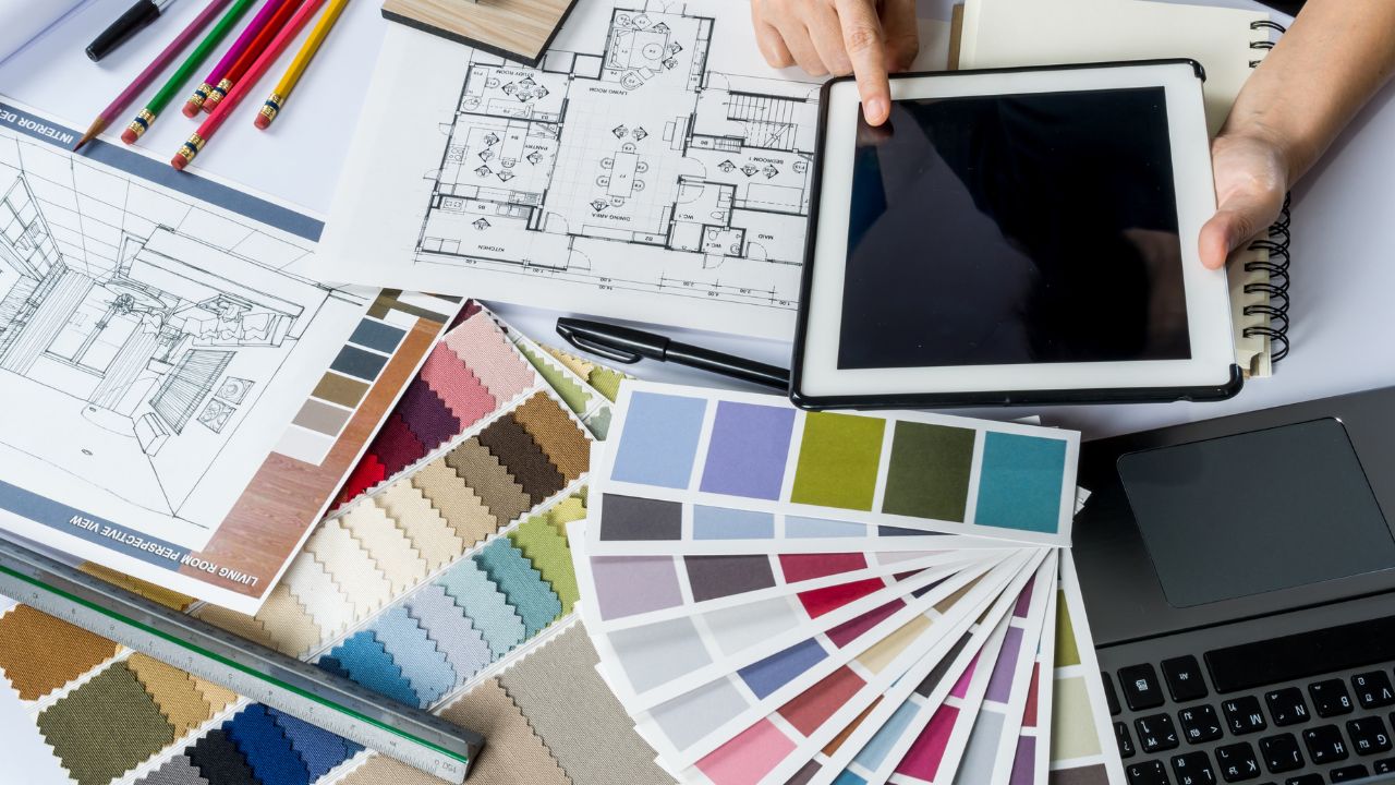 Workspace drawings and material samples during project briefing